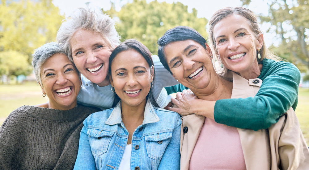 a group of women smiling to the camera