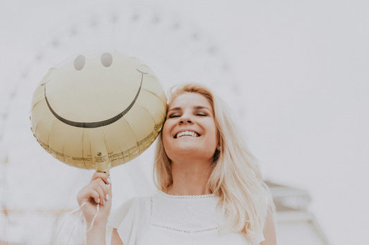 A woman holding a balloon