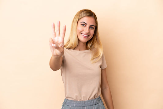 Woman holding three fingers up 