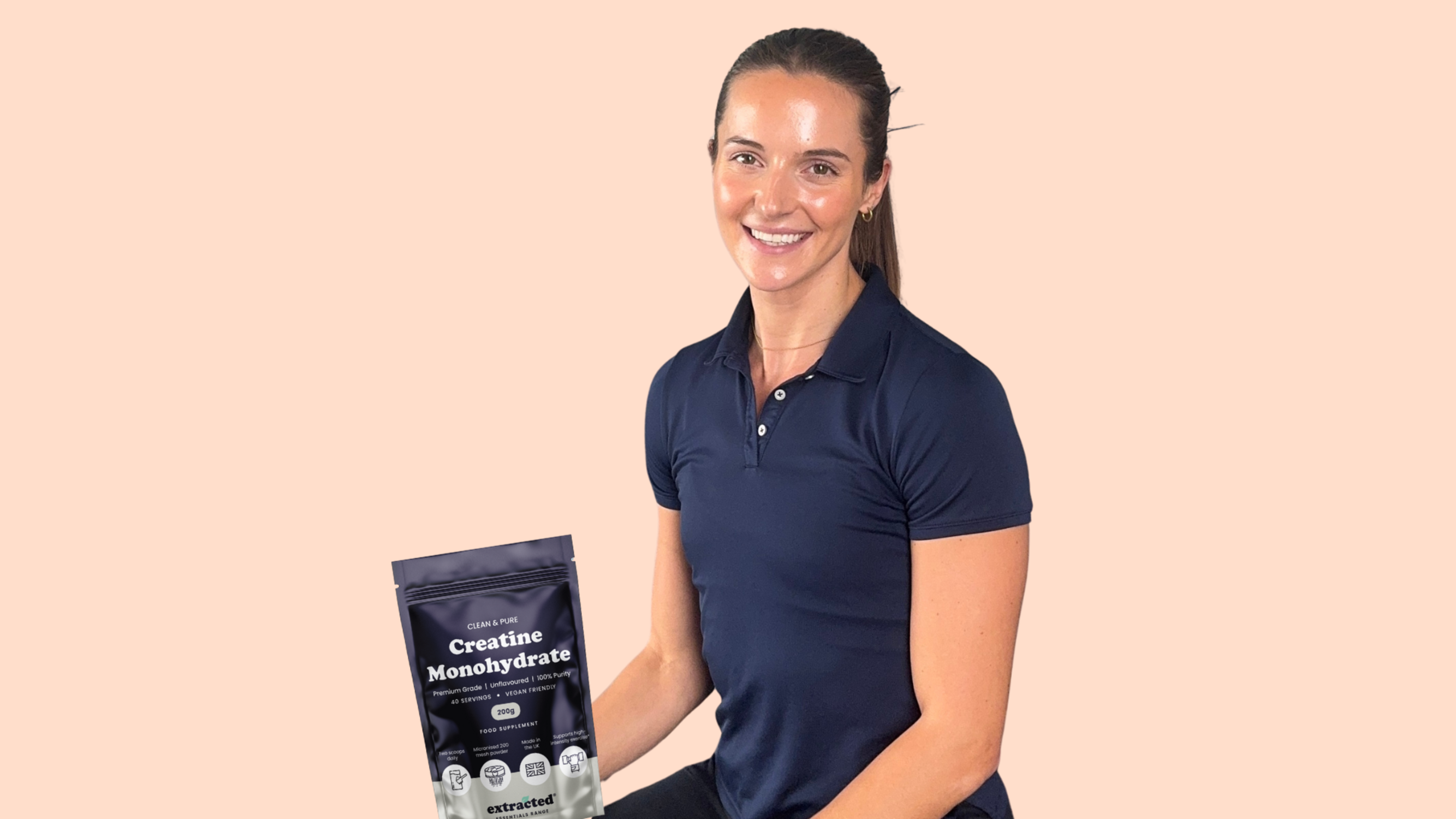 Lauren holding creatine smiling 