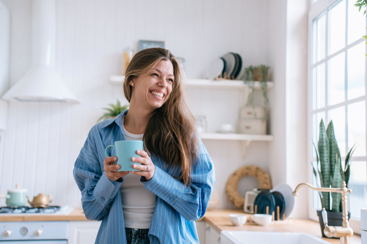 Woman holding a mug with both hands 