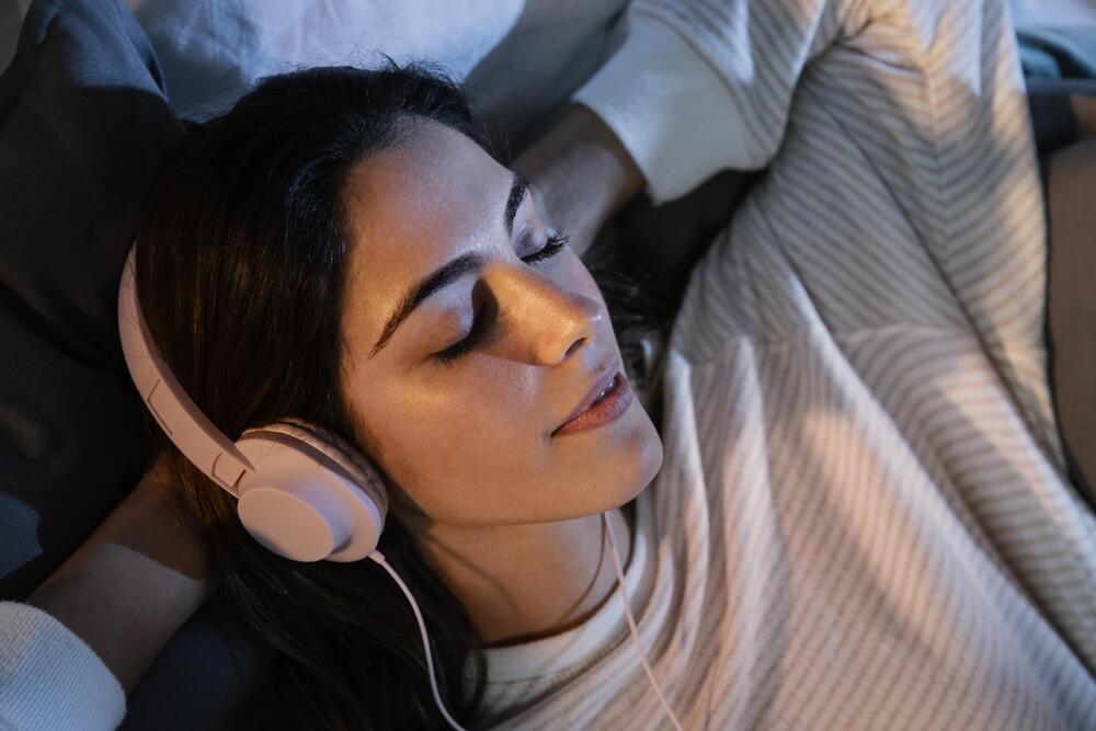 A woman with headphones on