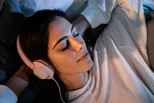 A woman with headphones on