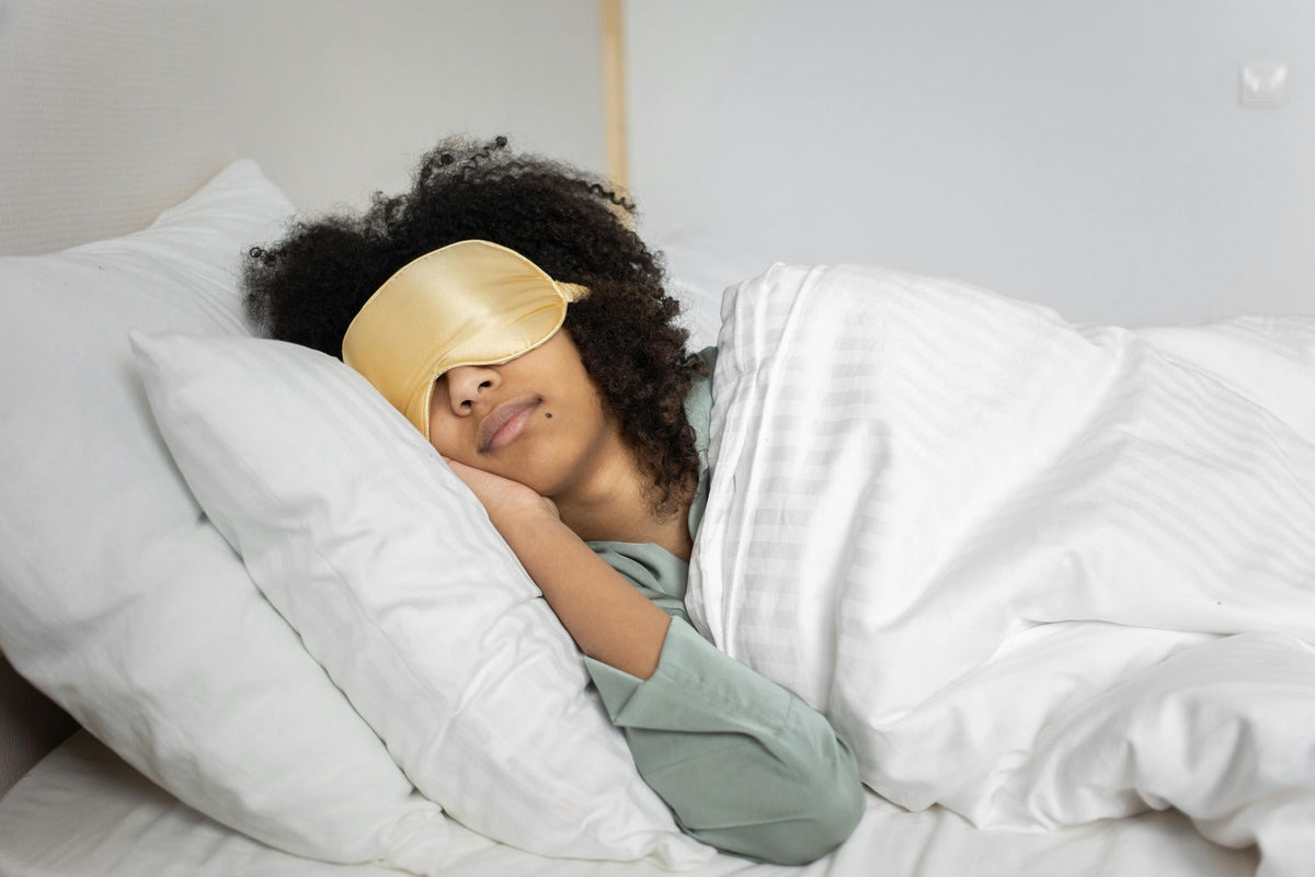 A woman sleeping in the daytime with an eye mask