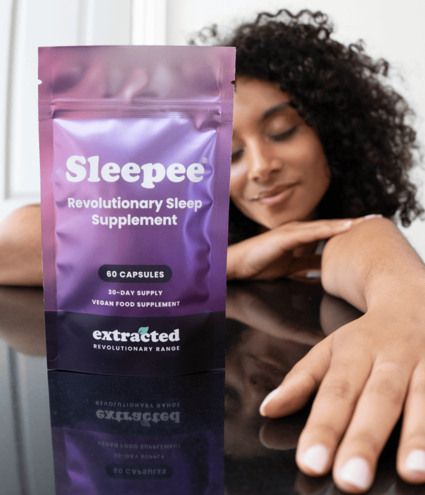 A pouch of Sleepee supplements with a woman in the background